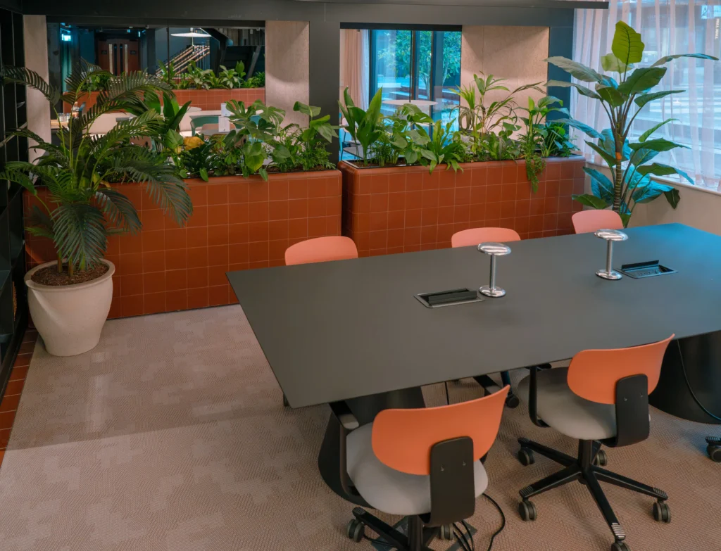 Live plants in built in furniture in communal lobby at Pall Mall